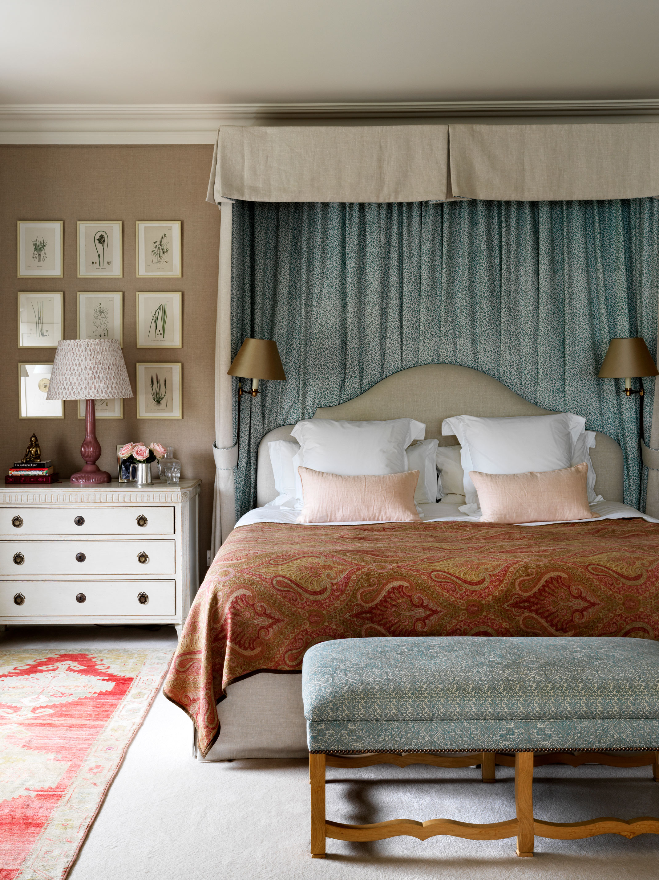 Best bedroom colors in a calming schceme, with duck egg blue bed canopy and bench seat, coffee-colored walls and burnt orange paisley print throw.