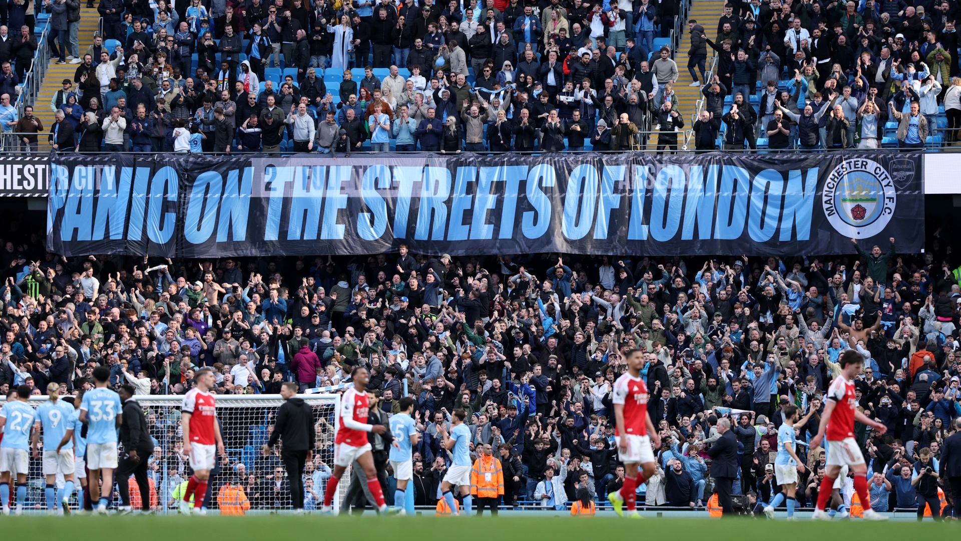 A banner reads 'Panic of the Streets of London' after Man City beat Arsenal in the Premier League