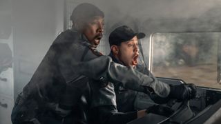 L-R: Russell (Eddie Murphy) and Travis (Pete Davidson) looking terrified behind the wheel of their truck in a scene from Prime Video's "The Pickup"