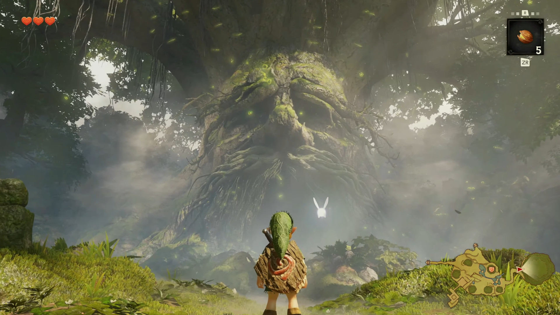 A screenshot of gameplay from the Ocarina of Time remake with Link looking at a massive tree