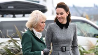 Queen Camilla and Catherine, Princess of Wales arrive for their visit to The Prince's Foundation training site in 2022