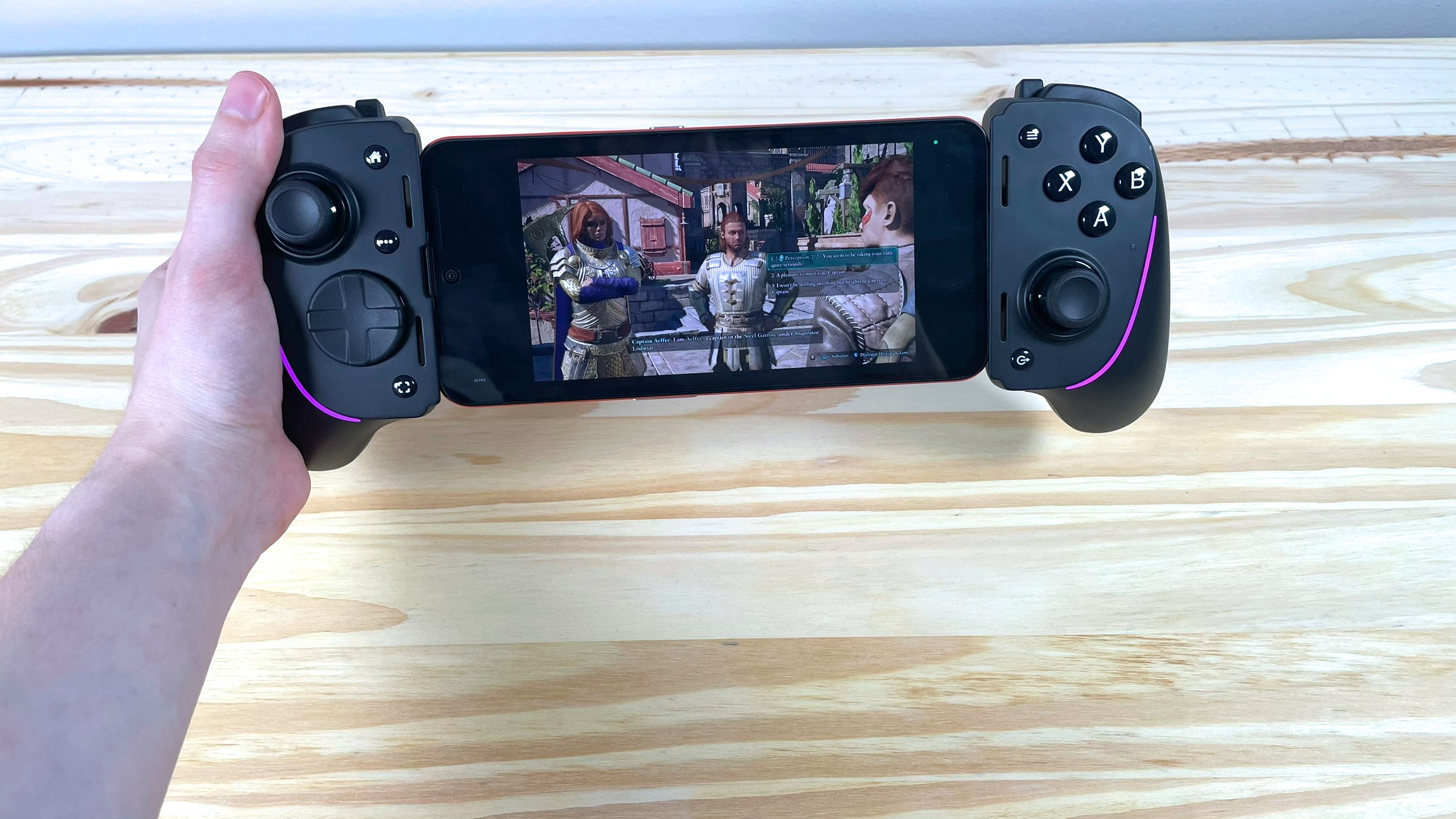 A Nothing CMF Phone 1 running Avowed with the Razer Kishi Ultra mobile controller