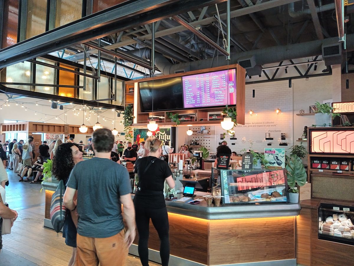 People lining up at a coffee shop