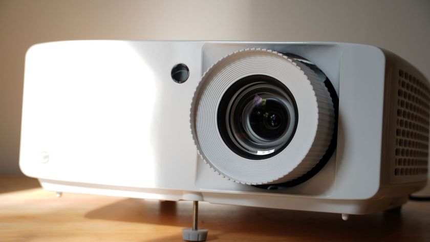 Optoma UHZ66 projector on table