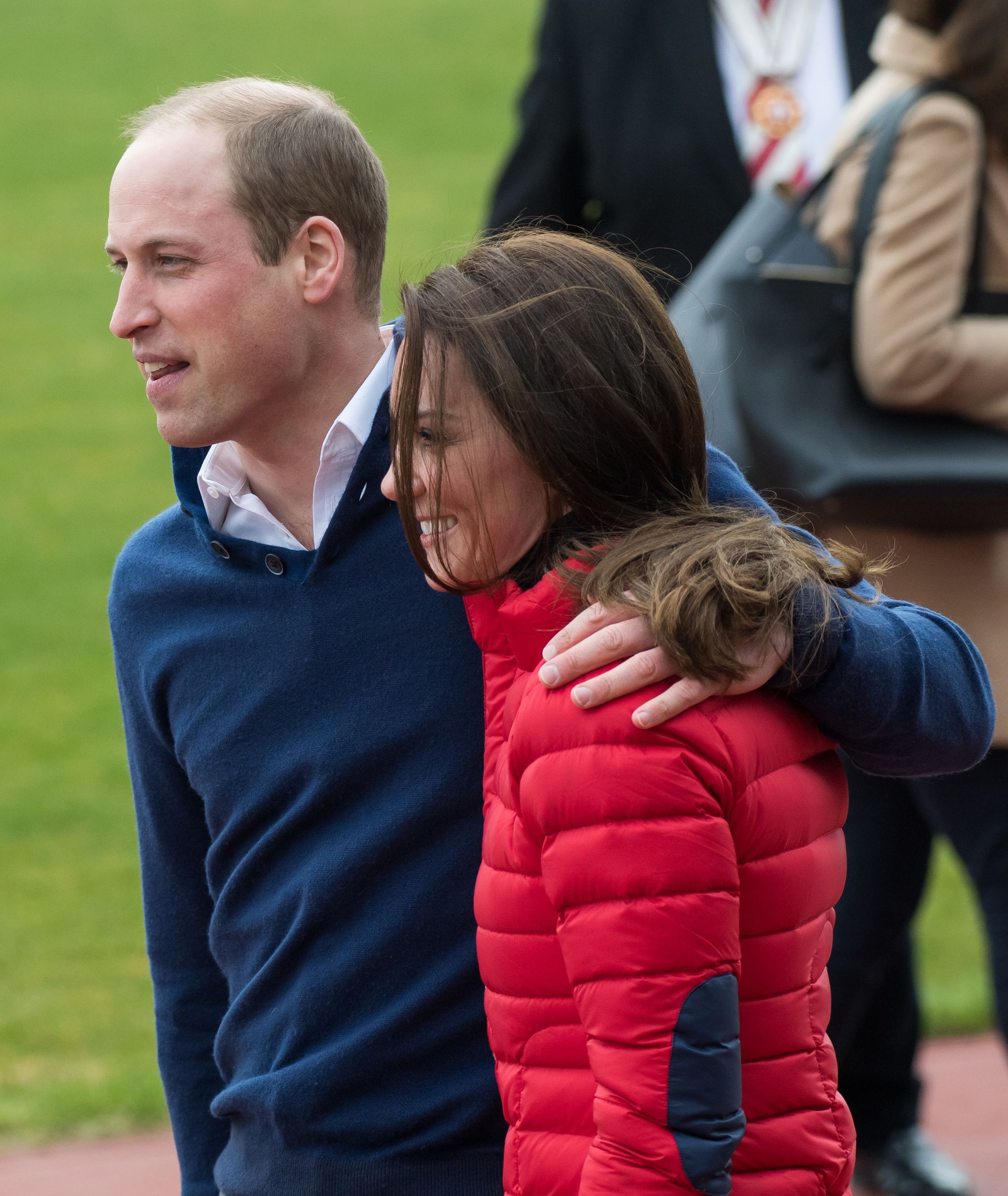 Prince William puts an arm around Kate Middleton