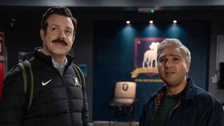 (L, R) Jason Sudeikis as Ted Lasso and Nick Mohammed as Nathan "Nate" Shelley in the locker room in Ted Lasso season 3 episode 12, "So Long, Farewell"