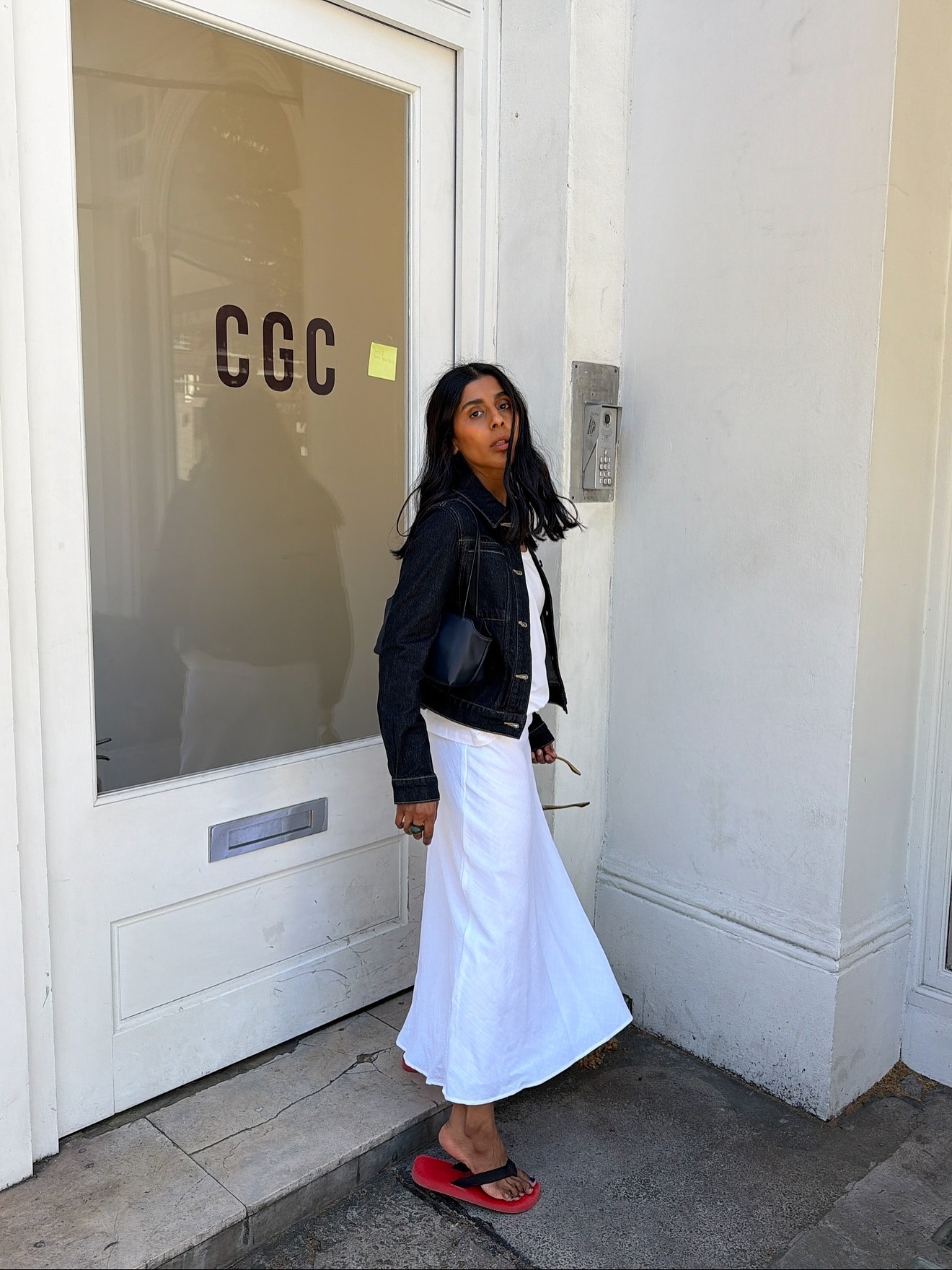 Monikh wears The Row flip flops for summer 2026