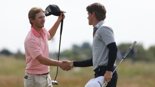 Two golfers shake hands