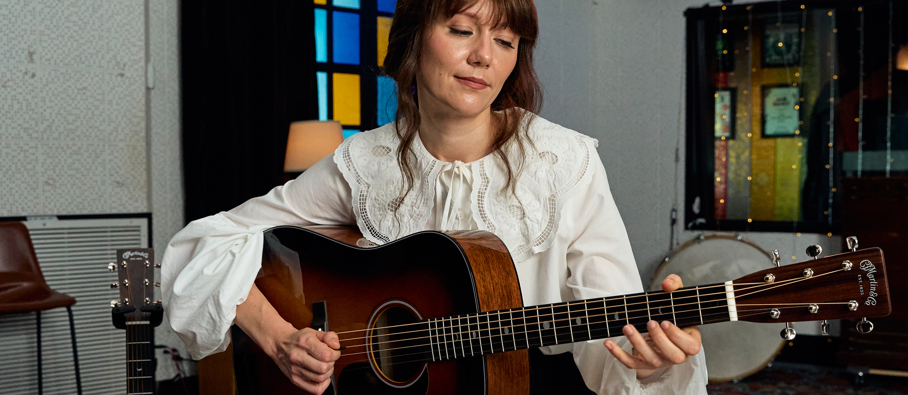 A photo of Molly Tuttle with the Martin D-18 Molly Tuttle