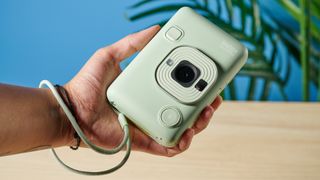 A matcha green Fujifilm Instax mini LiPlay 2-in-1 instant camera and printer