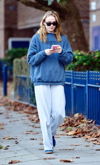 Sophie Turner wears a Taylor Swift-era tour sweatshirt while walking through New York City