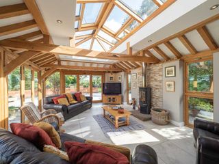 Prime Oak sunroom with woodburning stove and glazing