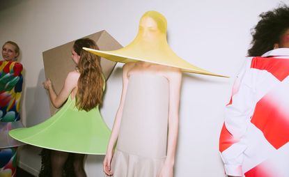 Models wear asymmetrical dresses, gauzy skirts and sunhats with sturdy lampshade-like hems