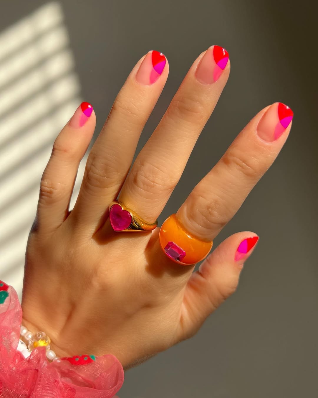 A negative space pink manicure by Hang Nguyen
