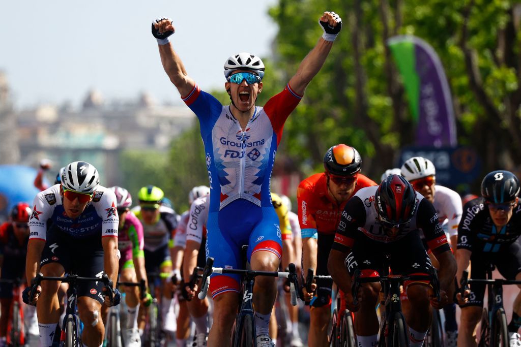 Team GroupamaFDJs French rider Arnaud Demare celebrates as he crosses the finish line to win the 4th stage of the Giro dItalia 2022 cycling race 174 kilometers between Catania and Messina Sicily on May 11 2022 Photo by Luca Bettini AFP Photo by LUCA BETTINIAFP via Getty Images