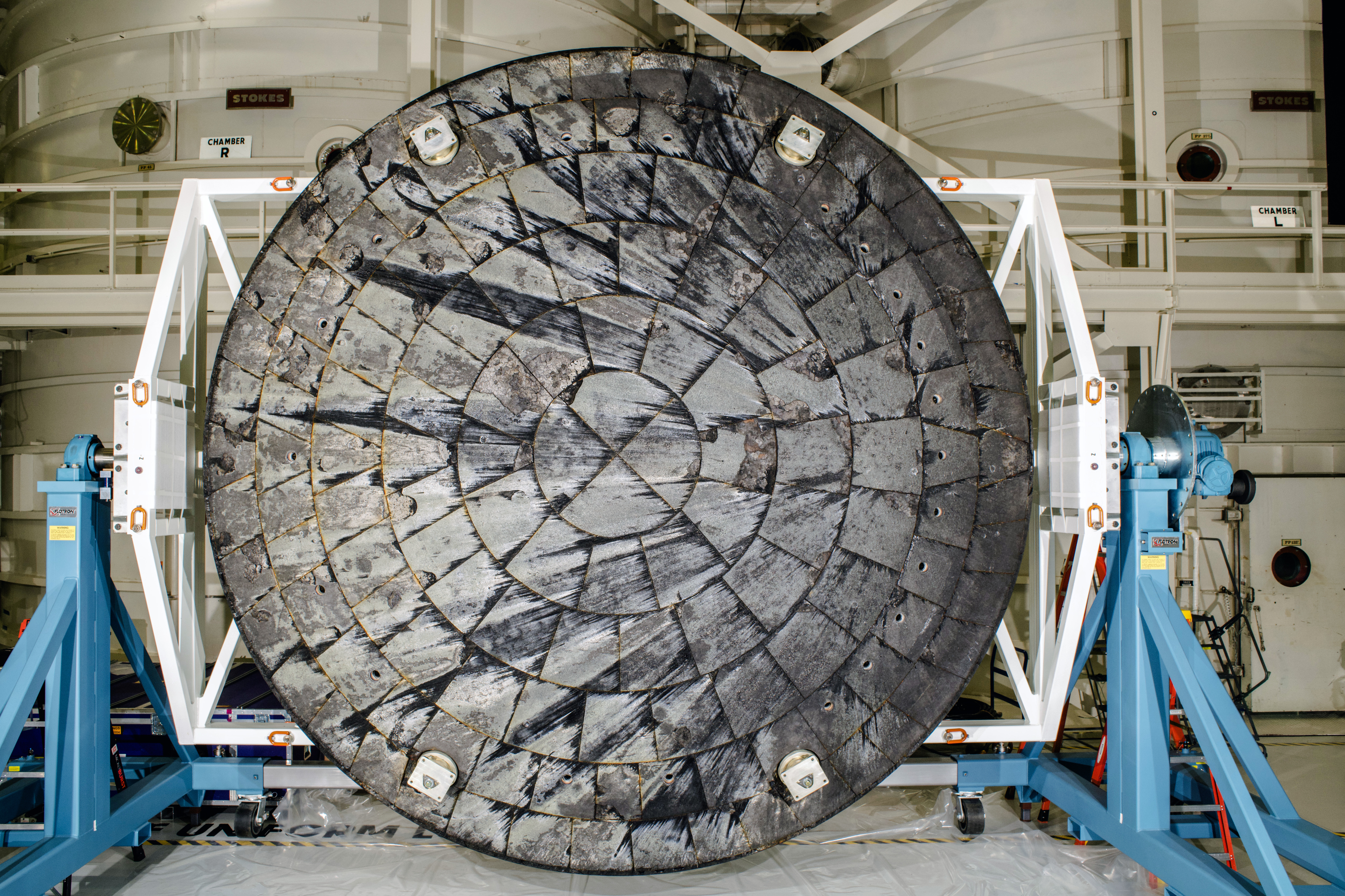 A photo of the Orion heat shield after being removed from the spacecraft for inspection.