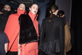 Sharp-edged tailored skirt-suits and high-necked blanket coats that gave way to softer
