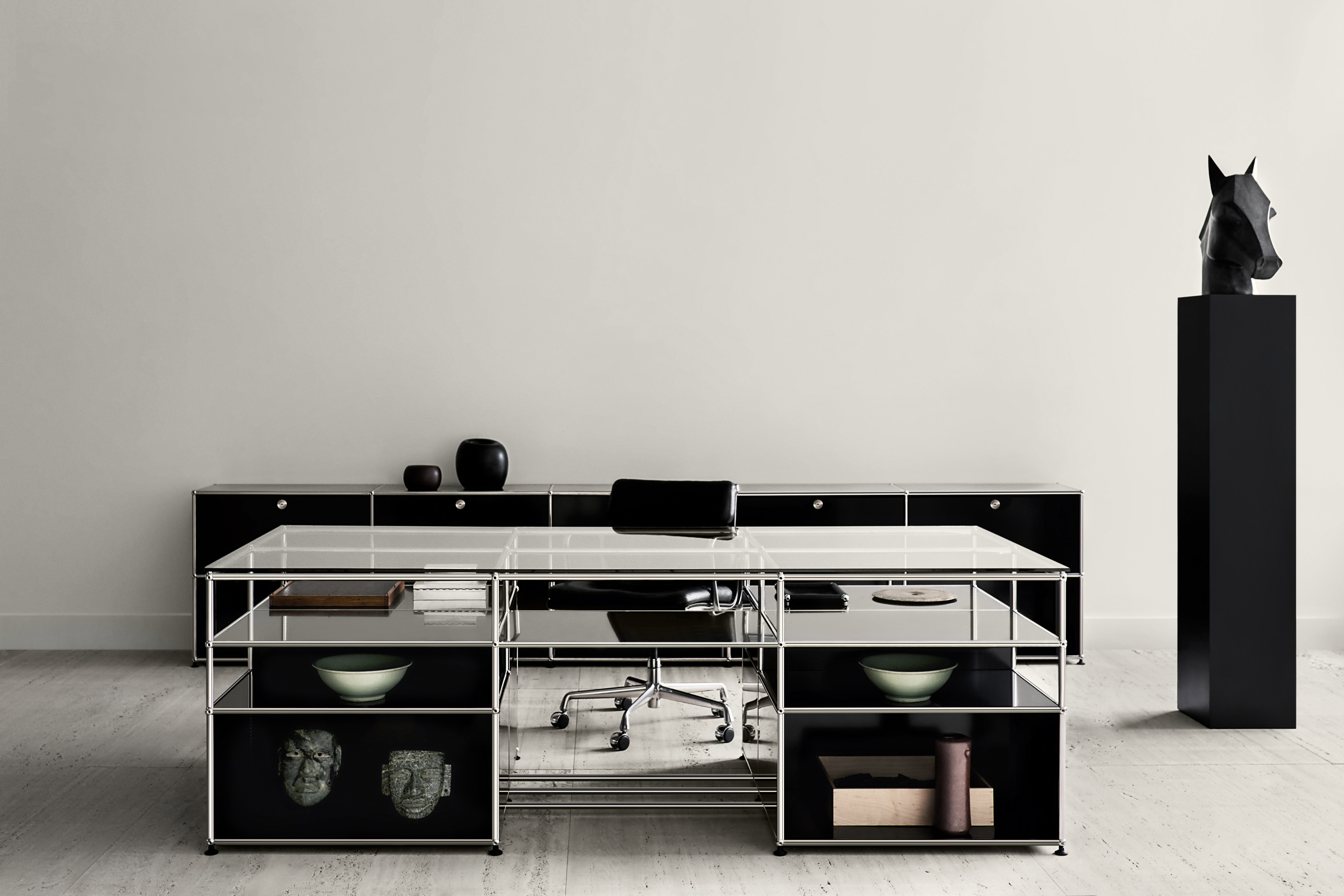 Black and white office furnished with USM Haller system