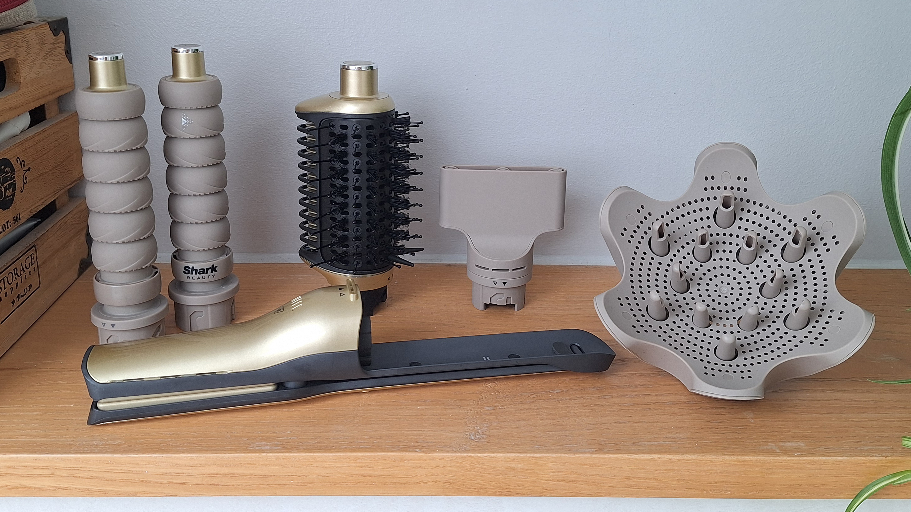All the attachments for the Shark Glam Multi-Styler on a shelf in reviewer&#039;s bathroom