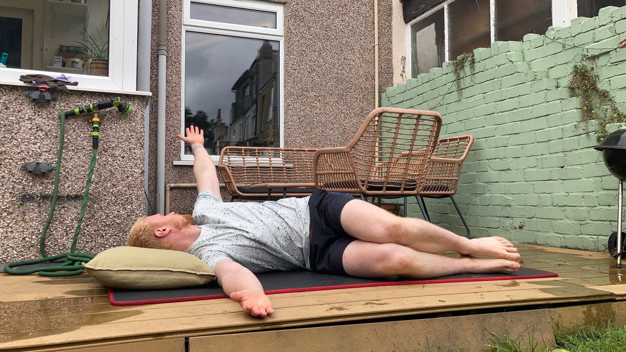 Fit&amp;Well fitness writer Harry Bullmore performing the book opening stretch