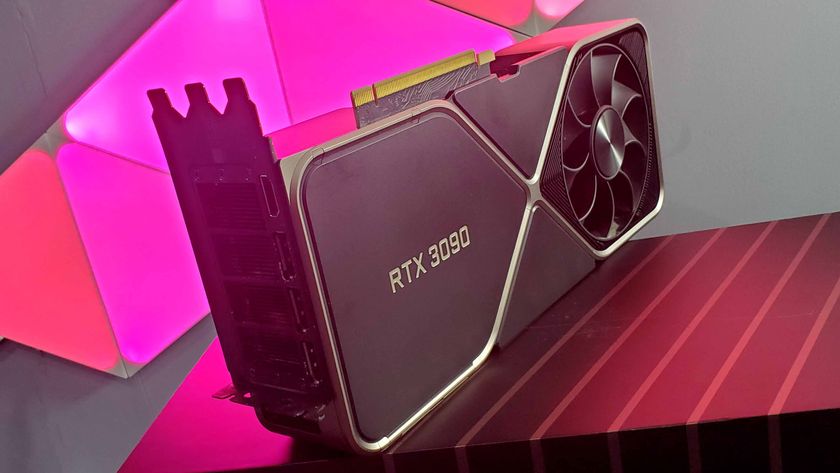 Nvidia RTX 3090 Founders Edition graphics card on its box, with a pink light in the background