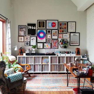 A long and low storage unit made with IKEA products, holding vinyl records