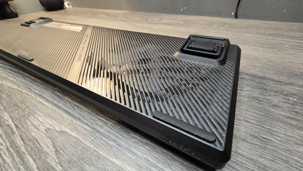The Asus ROG Strix II RX gaming keyboard photographed on a wooden desk.