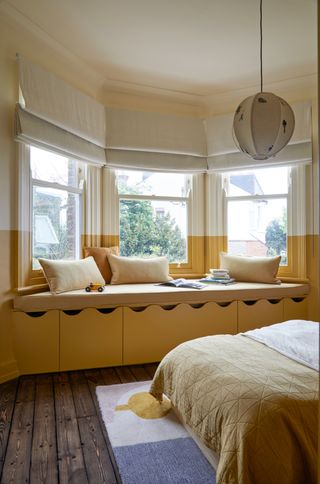 A mustard yellow bedroom