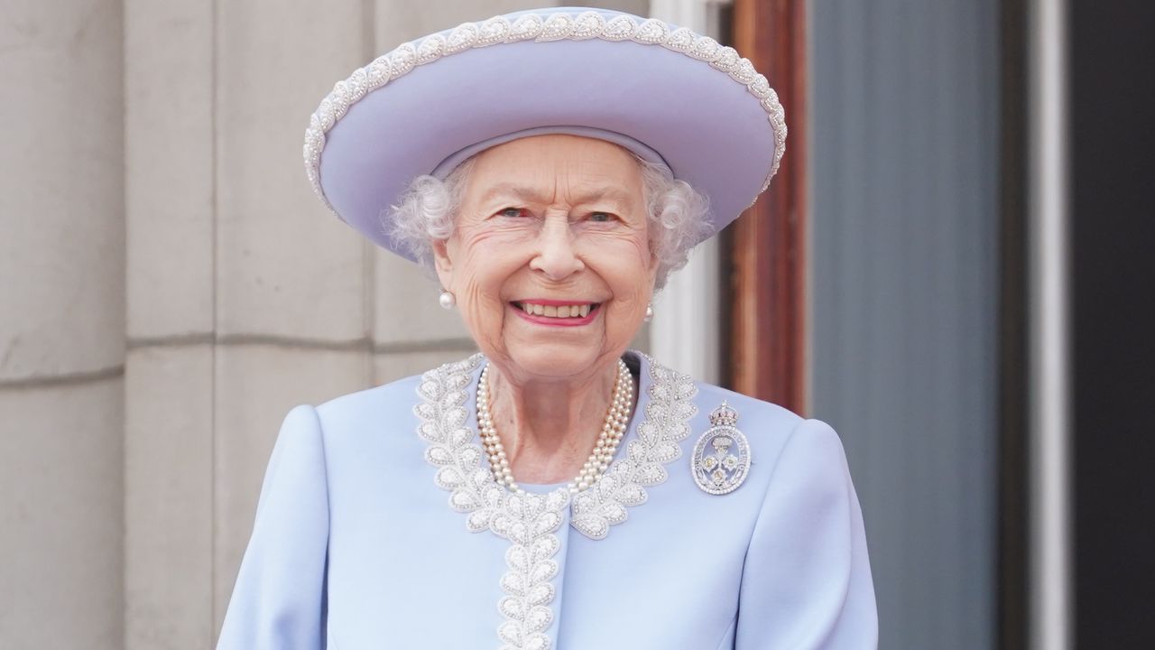 Queen Elizabeth &quot;sadly missed&quot; by fans. Seen here she watches from the balcony of Buckingham Palace