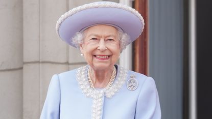 Queen Elizabeth "sadly missed" by fans. Seen here she watches from the balcony of Buckingham Palace
