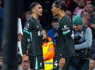 Liverpool captain Virgil van Dijk celebrates with teammate Trent Alexander-Arnold after scoring in the Premier League match against Arsenal at Emirates Stadium on 28 October, 2024