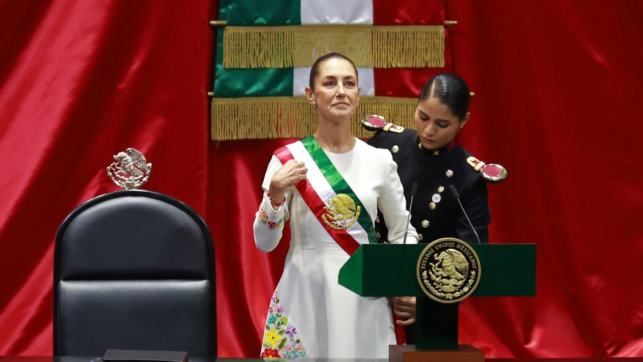 Mexican President Claudia Sheinbaum receives the presidential sash during her inauguration.