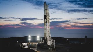 A used SpaceX Falcon 9 rocket carrying three Canadian Radarsat satellites stands ready to launch from Vandenberg Air Force Base, California. The rocket's first stage will launch a new Starlink mission from Florida on June 26, 2020..