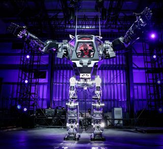 Amazon CEO Jeff Bezos piloted a giant "mech" robot at the 2017 Machine Learning, Home Automation, Robotics and Space Exploration (MARS) conference.