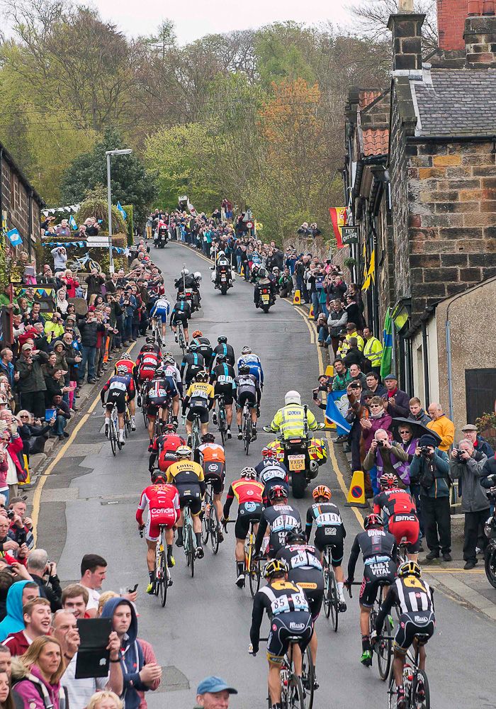 crowds watch riders climb during stage 1 at the Tour de Yorkshire