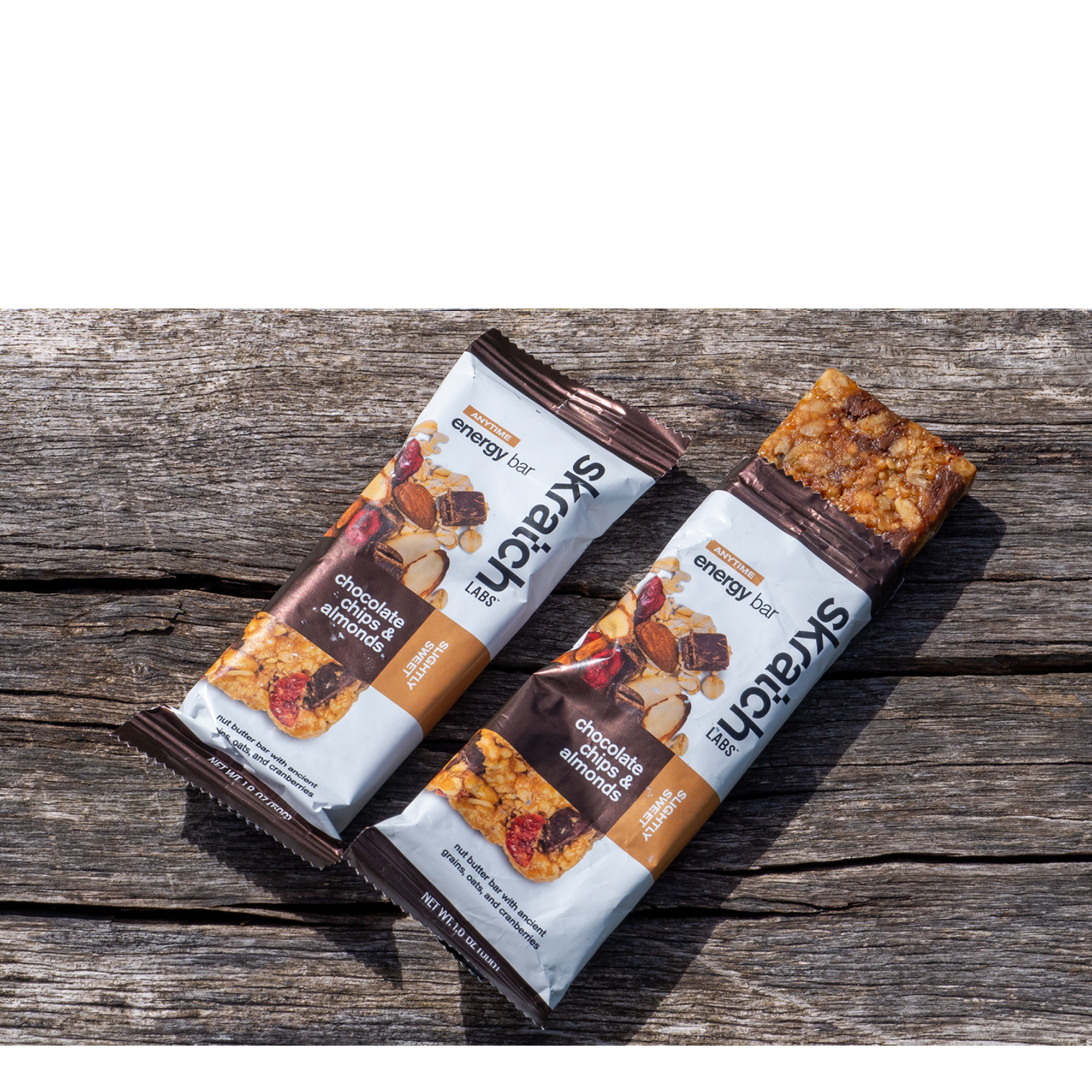 A pair of Skratch energy bars on a wooden bench