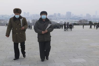 North Koreans walk in Pyongchang.