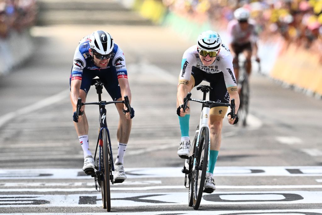 TOPSHOT Bahrain Victorious Slovenian rider Matej Mohoric R sprints to the finish line with Soudal QuickSteps Danish rider Kasper Asgreen L to win the 19th stage of the 110th edition of the Tour de France cycling race 173 km between MoiransenMontagne and Poligny in the Jura department of centraleastern France on July 21 2023 Photo by Marco BERTORELLO AFP Photo by MARCO BERTORELLOAFP via Getty Images