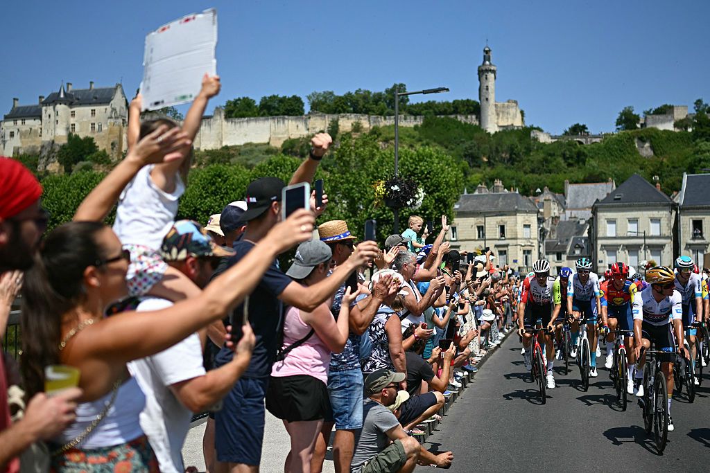 The pack of riders (peloton) cycles at the start of the 9th stage of the 112th edition of the Tour de France cycling race, 174.1 km between Chinon and Chateauroux, central France, on July 13, 2025. (Photo by Loic VENANCE / AFP) (Photo by LOIC VENANCE/AFP via Getty Images)