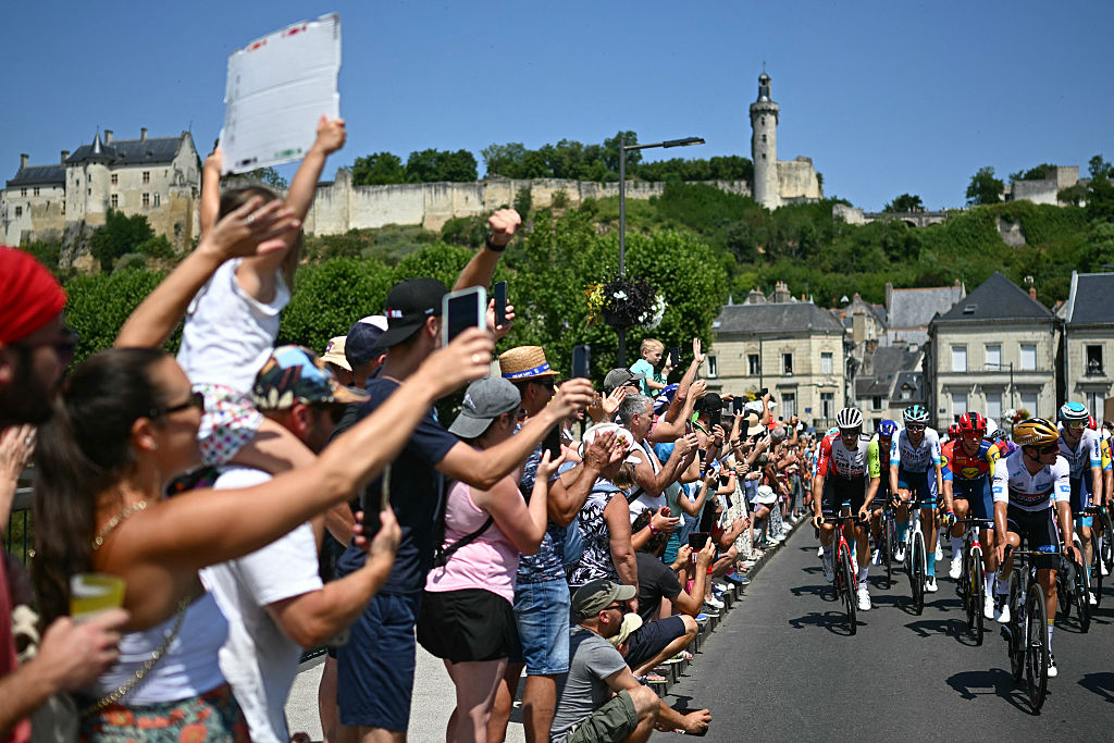 The pack of riders (peloton) cycles at the start of the 9th stage of the 112th edition of the Tour de France cycling race, 174.1 km between Chinon and Chateauroux, central France, on July 13, 2025. (Photo by Loic VENANCE / AFP) (Photo by LOIC VENANCE/AFP via Getty Images)