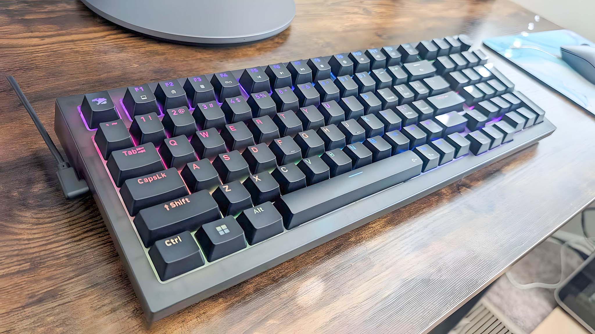 iBuyPower MK9 Pro RGB Mechanical Keyboard sitting on a desk.