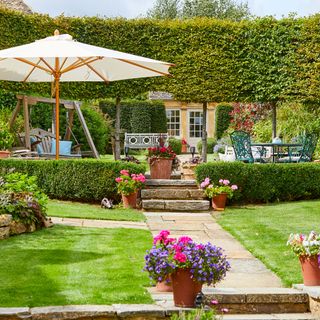 beautiful garden area with dining table and bench