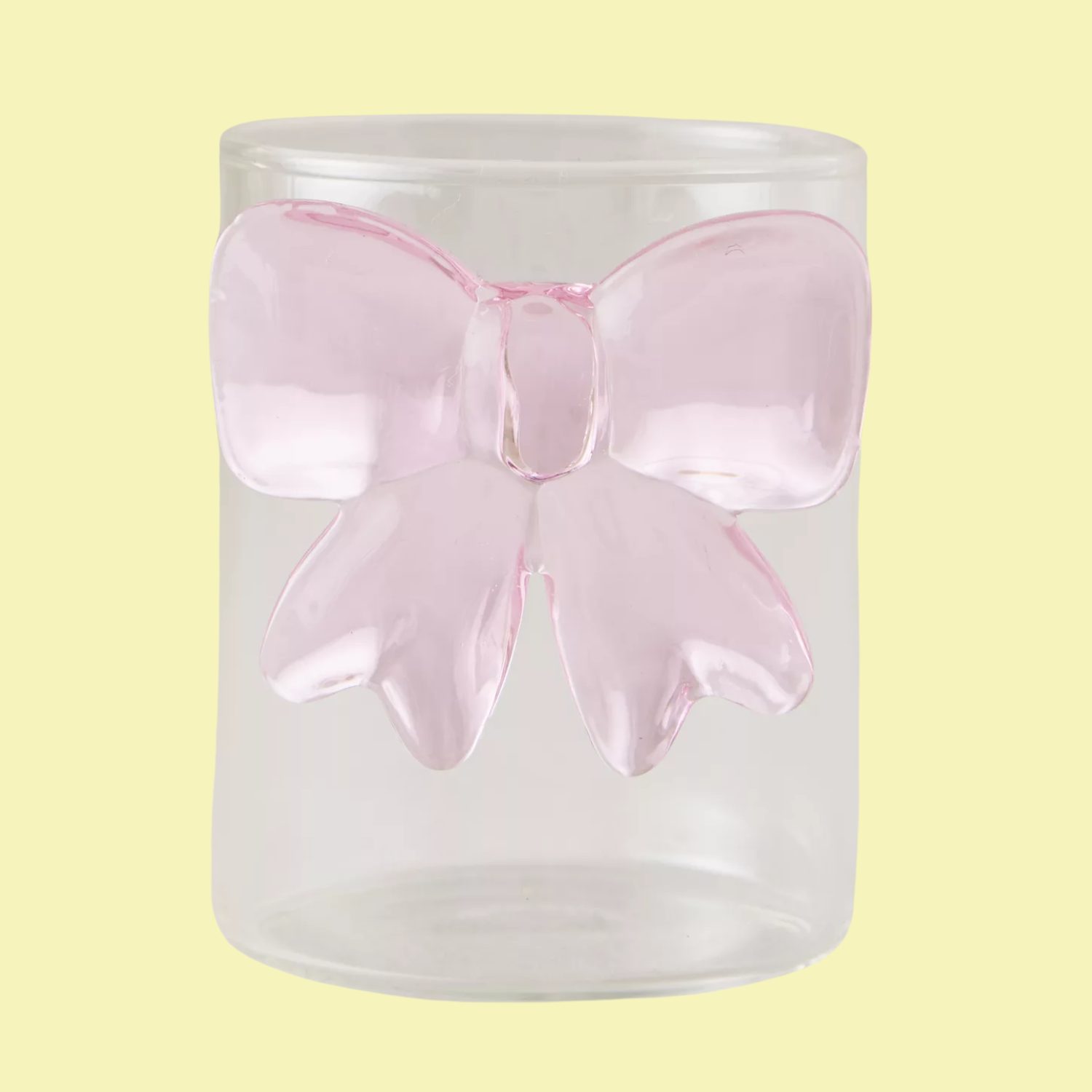 A glass with a pink bow detail