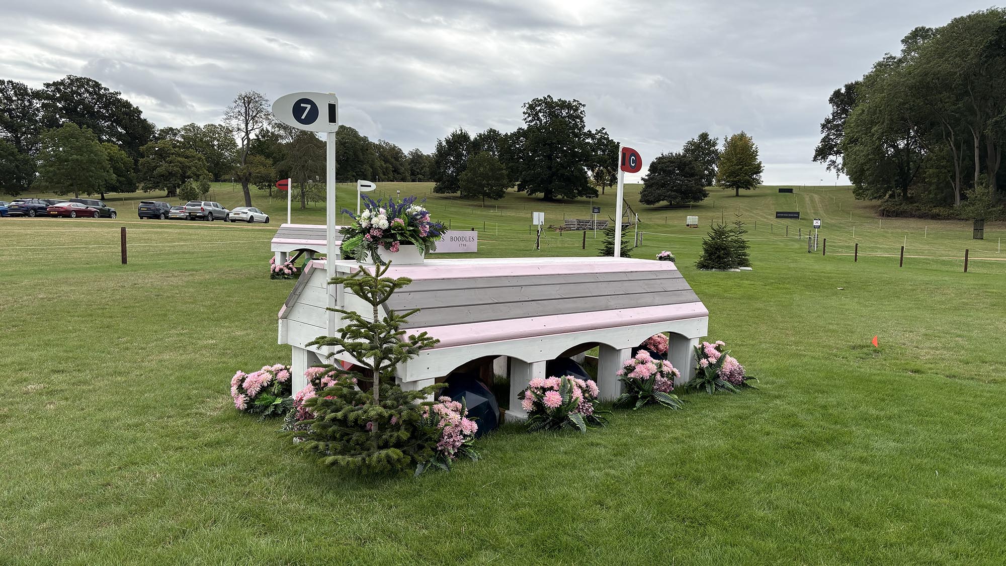 Angled pink grey and white fence on the Burghley cross-country course 2026