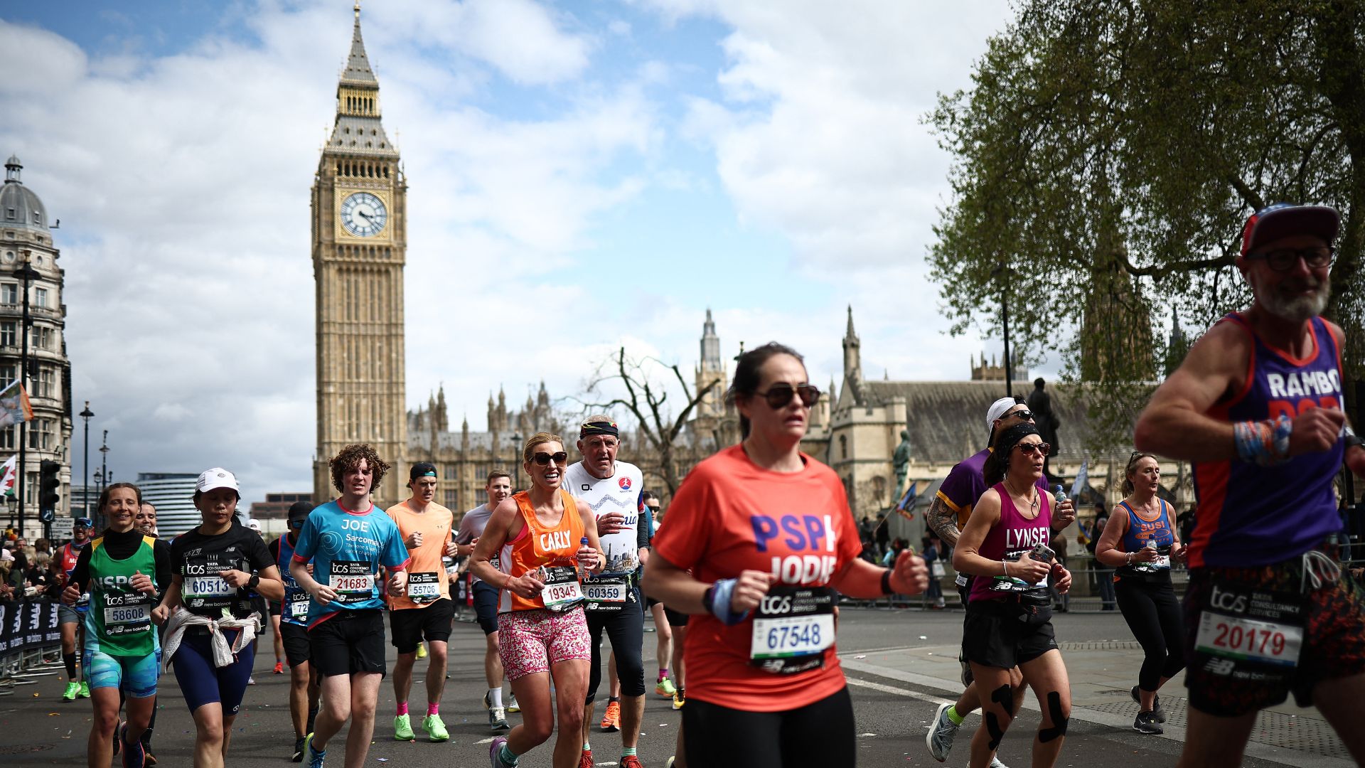 Fun runners compete near the Houses of Parliament during the London Marathon in central London