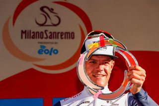 Team Trek rider Belgiums Jasper Stuyven celebrates on the podium after winning the oneday classic cycling race MilanSan Remo on March 20 2021 in San Remo Photo by Tommaso PELAGALLI AFP Photo by TOMMASO PELAGALLIAFP via Getty Images