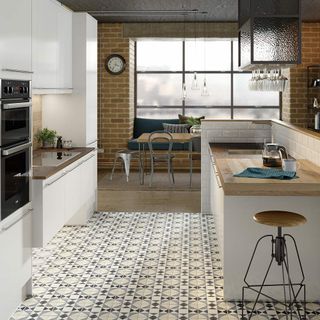 kitchen with brick wall and sink