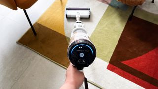 Shark Cordless Detect Pro being used on a rug