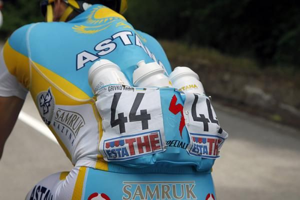 Astana's Andriy Grivko has got some bottles for his teammates.