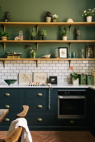 green kitchen with open shelving by deVOL